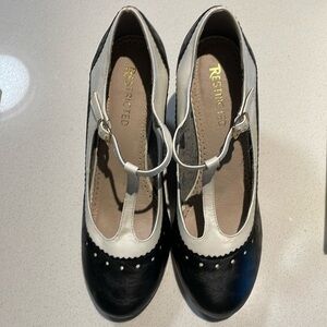 Restricted Showcase black and white t-strap wedge heel